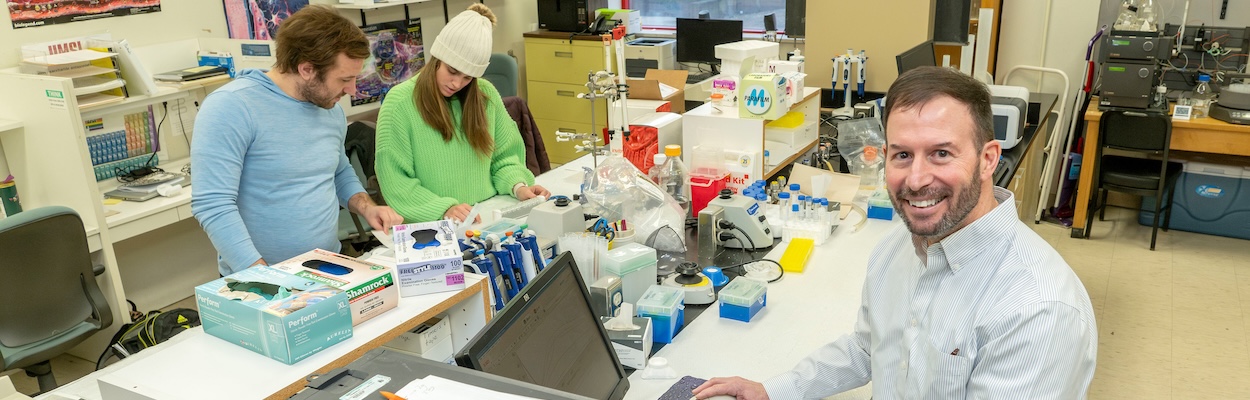 Dr. Nichols in a lab with students